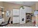 Laundry room featuring stackable washer/dryer units and built-in cabinets for added storage at 530 Chicapoo Dr, Marietta, GA 30066