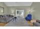 Bright living room with hardwood floors, neutral walls, and a view into the sunroom at 530 Chicapoo Dr, Marietta, GA 30066