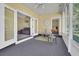 Bright sunroom with outdoor views, featuring seating area and views into living room and bedroom at 530 Chicapoo Dr, Marietta, GA 30066