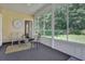 Relaxing sunroom featuring lots of windows to provide an open view of the outdoor space at 530 Chicapoo Dr, Marietta, GA 30066