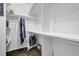 Bright walk-in closet offering ample storage with shelves and rods for organized wardrobe space at 530 Chicapoo Dr, Marietta, GA 30066