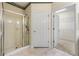 Bathroom includes a walk-in shower with glass doors and access to a walk-in closet with ample shelving at 2001 Macland Square Dr # 11, Marietta, GA 30064