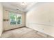 Bright bedroom featuring a large window providing ample natural light and plush carpeting at 2001 Macland Square Dr # 11, Marietta, GA 30064