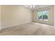 Bright bedroom features neutral carpet, a ceiling fan, and a large window offering ample natural light at 2001 Macland Square Dr # 11, Marietta, GA 30064