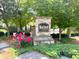Stone entrance sign with landscaping and mature trees at Macland Square at 2001 Macland Square Dr # 11, Marietta, GA 30064