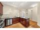Well-lit kitchen featuring stainless steel appliances, wood cabinets, and granite countertops at 2001 Macland Square Dr # 11, Marietta, GA 30064