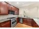 Elegant kitchen featuring stainless steel appliances, granite counters, and ample cabinetry for storage convenience at 2001 Macland Square Dr # 11, Marietta, GA 30064