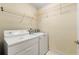Laundry room with washer, dryer and wire shelving at 2001 Macland Square Dr # 11, Marietta, GA 30064