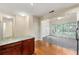 Open-concept kitchen and living room with hardwood and tile flooring at 2001 Macland Square Dr # 11, Marietta, GA 30064