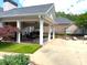 Inviting covered outdoor patio with ceiling fans, seating, and views of the surrounding grounds at 2001 Macland Square Dr # 11, Marietta, GA 30064
