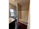 Bathroom showcasing a shower-tub combo and granite vanity at 2363 Bear Mountain St, Lithonia, GA 30058