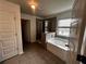 Primary bathroom featuring a soaking tub, glass shower, and tile floor at 2363 Bear Mountain St, Lithonia, GA 30058