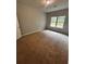 Empty bedroom featuring a window for natural light at 2363 Bear Mountain St, Lithonia, GA 30058