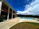 Large community swimming pool with ample seating, deck space, and a grassy area at 2363 Bear Mountain St, Lithonia, GA 30058