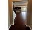 Open floorplan foyer view into kitchen with wood floors and view of backyard at 2363 Bear Mountain St, Lithonia, GA 30058