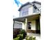 Inviting front porch with stone accents and supporting pillars on a sunny day at 2363 Bear Mountain St, Lithonia, GA 30058
