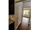 Hallway leading to dining room showing hardwood floors and neutral paint at 2363 Bear Mountain St, Lithonia, GA 30058