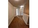 Upstairs hallway with carpet and white doors, neutral paint at 2363 Bear Mountain St, Lithonia, GA 30058