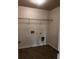 Laundry room with tile flooring and utility connections at 2363 Bear Mountain St, Lithonia, GA 30058