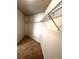 Carpeted walk-in closet, featuring white wire shelving at 2363 Bear Mountain St, Lithonia, GA 30058