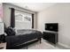 Cozy bedroom with a comfortable bed, dresser, and a large window at 2406 Lakeshore Ln, Atlanta, GA 30316