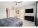 Spacious bedroom with a ceiling fan, a large window, and access to the ensuite bathroom at 2406 Lakeshore Ln, Atlanta, GA 30316