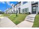 Street view showcasing modern townhomes with neat landscaping and inviting sidewalks at 2406 Lakeshore Ln, Atlanta, GA 30316