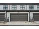 Attached garages featuring gray doors and matching trim at 2406 Lakeshore Ln, Atlanta, GA 30316