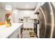 Well-equipped kitchen features white cabinetry, a center island, and stainless steel appliances at 2406 Lakeshore Ln, Atlanta, GA 30316