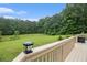 View from the deck overlooking a spacious, green backyard surrounded by lush trees and with privacy at 4746 Mulberry Rock Rd, Dallas, GA 30157
