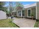View of the home's exterior with a concrete patio area, ideal for outdoor dining and entertaining in the backyard at 4746 Mulberry Rock Rd, Dallas, GA 30157