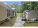 Exterior view of the property showcasing the backyard, storage shed, and well-maintained landscaping at 4746 Mulberry Rock Rd, Dallas, GA 30157