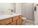 Bathroom featuring a vanity, a toilet, and a shower with a chevron patterned curtain at 4746 Mulberry Rock Rd, Dallas, GA 30157