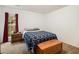 Bedroom features a bed, chest, side table, window and neutral carpet at 4746 Mulberry Rock Rd, Dallas, GA 30157