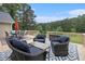 Inviting outdoor deck area features stylish wicker furniture, perfect for relaxing and enjoying the scenic views at 4746 Mulberry Rock Rd, Dallas, GA 30157