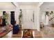 Inviting entryway with hardwood floors, white walls, and plant accents leading into the rest of the home at 4746 Mulberry Rock Rd, Dallas, GA 30157