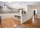 The kitchen features hardwood floors, pendant lights, a counter bar, and stainless steel appliances at 4746 Mulberry Rock Rd, Dallas, GA 30157