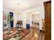 Cozy living room featuring hardwood floors, chandelier, and a view into the next room at 4746 Mulberry Rock Rd, Dallas, GA 30157