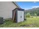 Exterior view of a storage shed on the property showing construction, design, and surrounding landscaping at 4746 Mulberry Rock Rd, Dallas, GA 30157