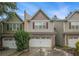 Charming two-story townhome with attached two-car garage and brick accents in desirable neighborhood at 1684 Tailmore Ln, Lawrenceville, GA 30043