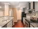 Modern kitchen with granite countertops, stainless steel appliances, and stylish backsplash at 1684 Tailmore Ln, Lawrenceville, GA 30043