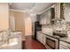 Modern kitchen with granite countertops, stainless steel appliances, and stylish backsplash at 1684 Tailmore Ln, Lawrenceville, GA 30043
