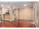 Open-concept living space featuring hardwood floors, and seamless kitchen access at 1684 Tailmore Ln, Lawrenceville, GA 30043