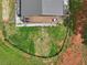 Overhead shot of a house with a deck, fire pit, and fenced in yard at 1971 Centennial Rd, Rutledge, GA 30663