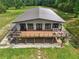 An aerial view of a stylish home boasting a large deck and expansive outdoor space at 1971 Centennial Rd, Rutledge, GA 30663