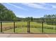 Beautiful view of trees and the backyard from the outdoor deck, complete with secure railings at 1971 Centennial Rd, Rutledge, GA 30663