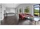 Spacious bedroom with hardwood floors, large windows, and comfortable seating area at 1971 Centennial Rd, Rutledge, GA 30663