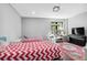 Bright bedroom featuring twin beds, hardwood floors, and a stylish vanity offering a comfortable and inviting space at 1971 Centennial Rd, Rutledge, GA 30663