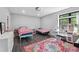 bedroom with two twin beds and large, sunny window at 1971 Centennial Rd, Rutledge, GA 30663