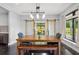 Charming dining room with a wooden table, bench, and sliding barn doors at 1971 Centennial Rd, Rutledge, GA 30663